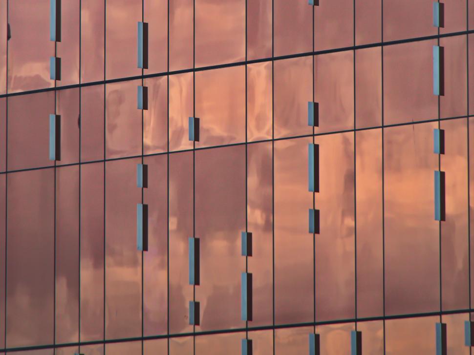Free Image of Reflective façade with abstract pattern of elements 