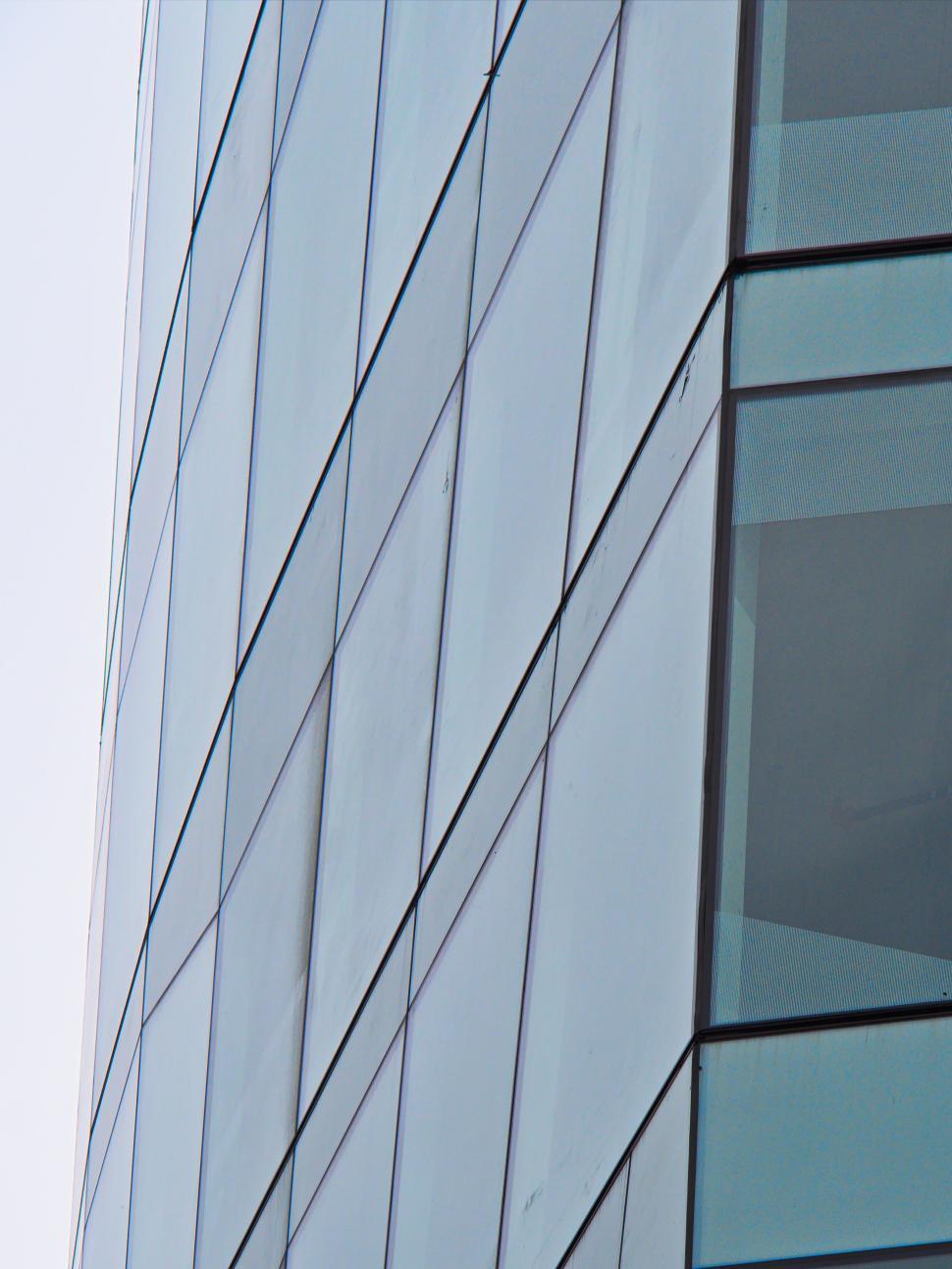 Free Image of Close-up view of a modern glass building facade 