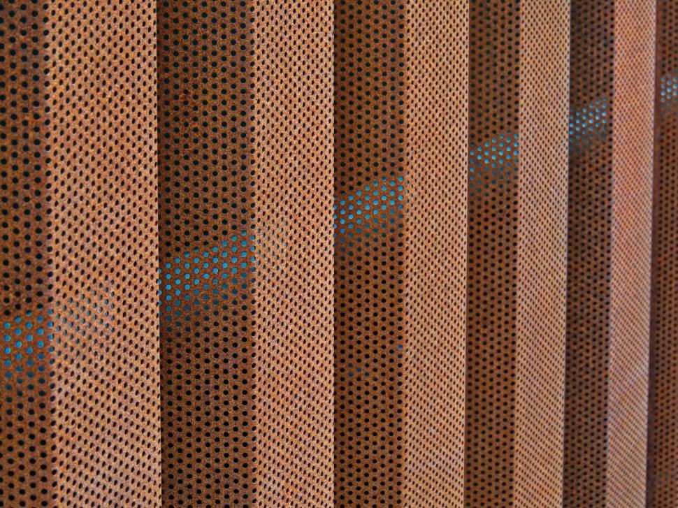 Free Image of Patterned metal cladding with perforated design structure. 