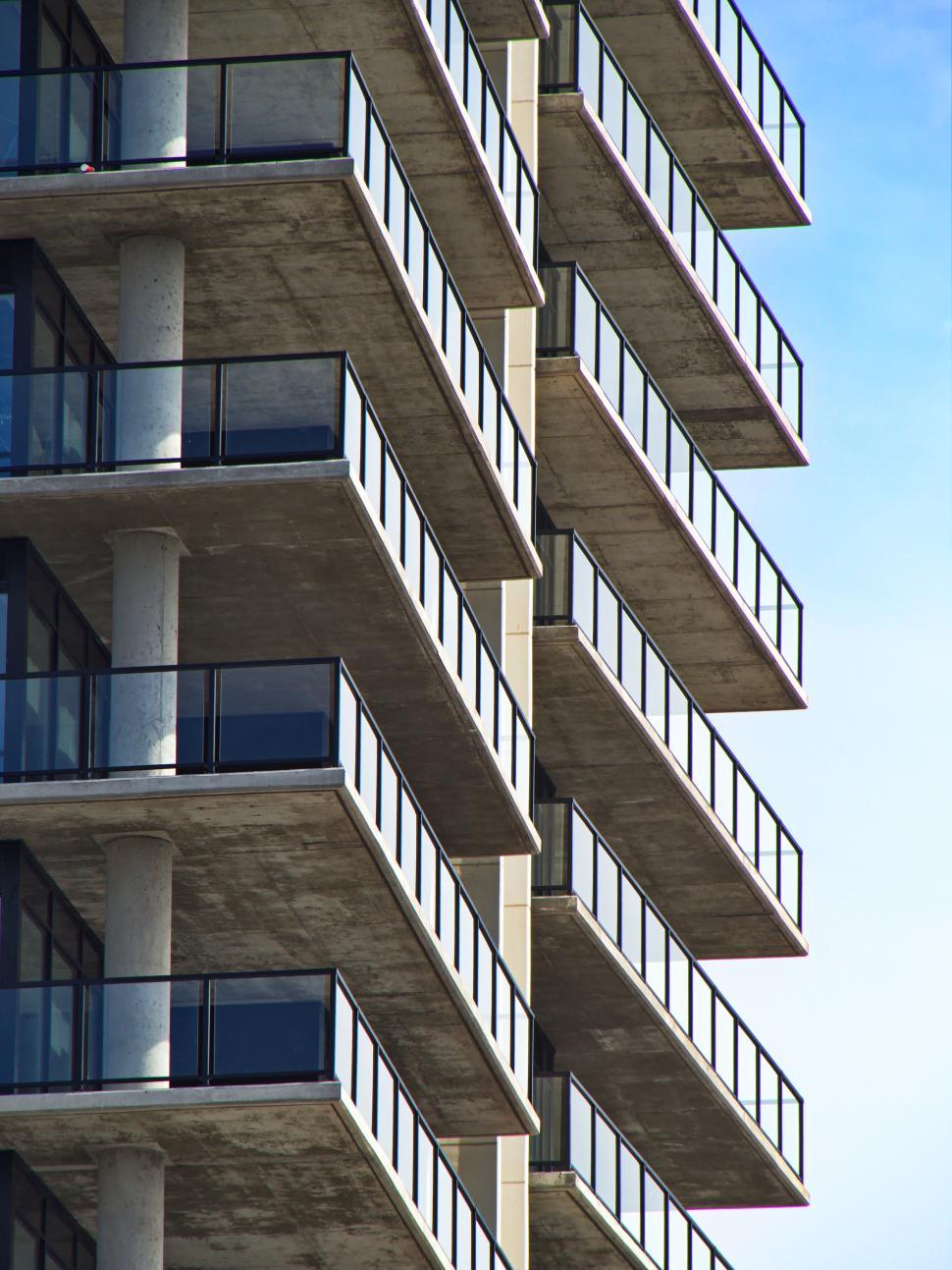 Free Image of Series of balconies on modern residential building facade. 