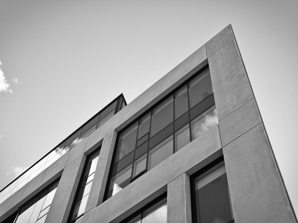 Free Image of Modern architectural building with glass windows, sky view 
