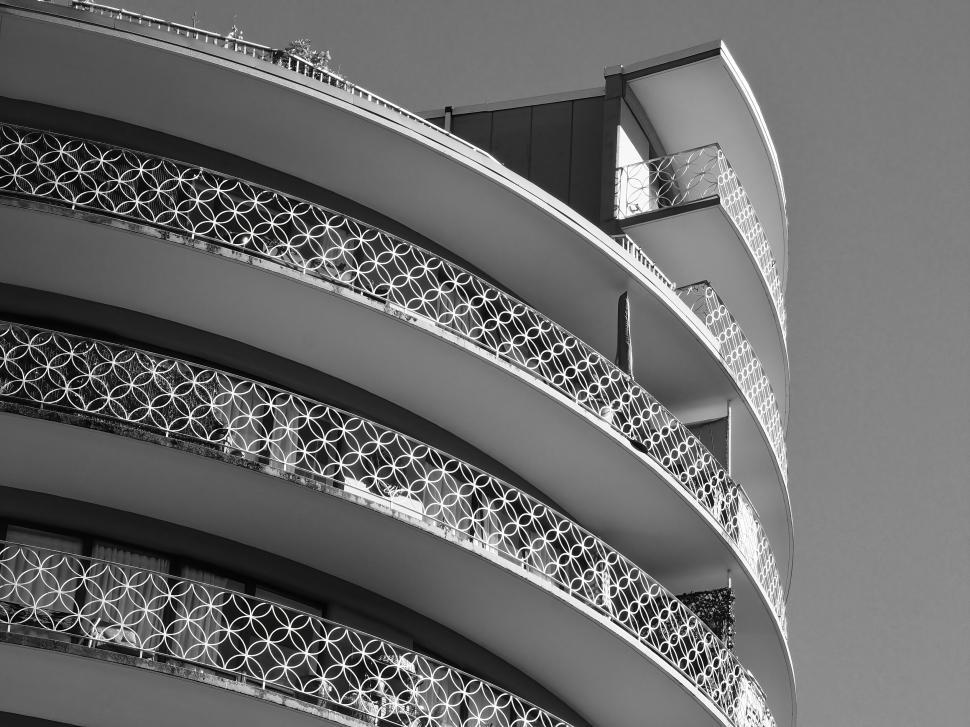 Free Image of Elegant modern building facade with decorative railings. 