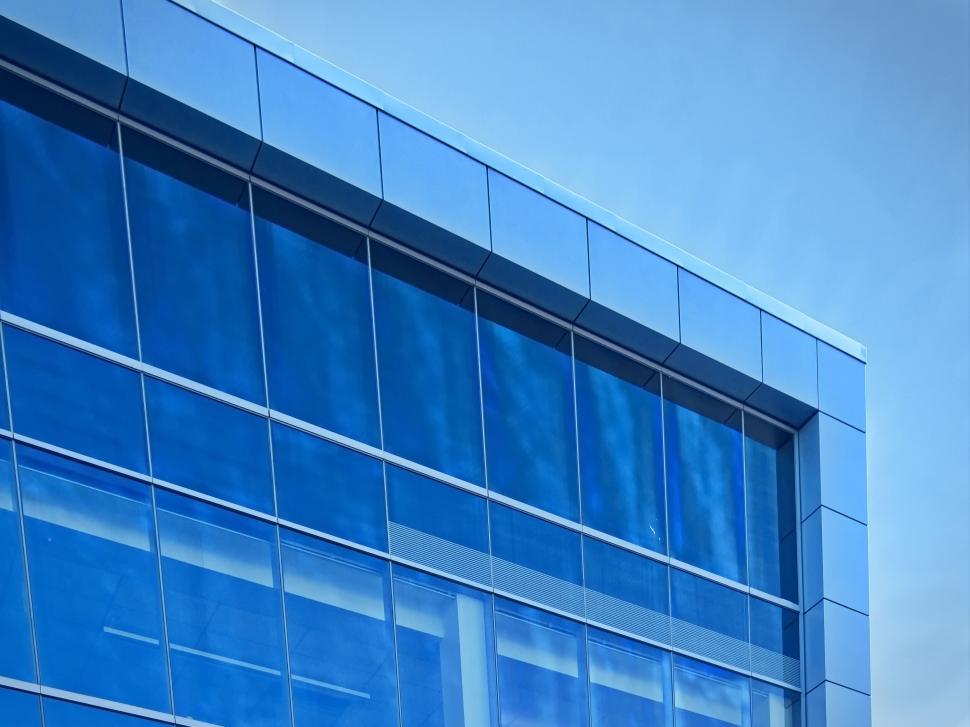 Free Image of Blue modern building against clear sky background image 