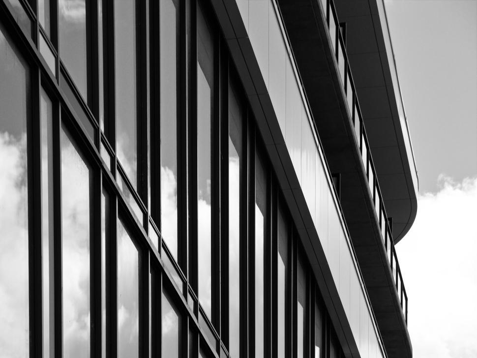 Free Image of Modern building facade with reflective glass windows. 