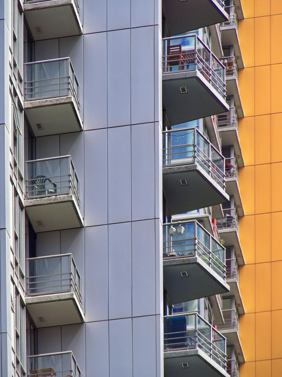 Free Image of Modern high-rise apartments with balconies and gray exterior. 