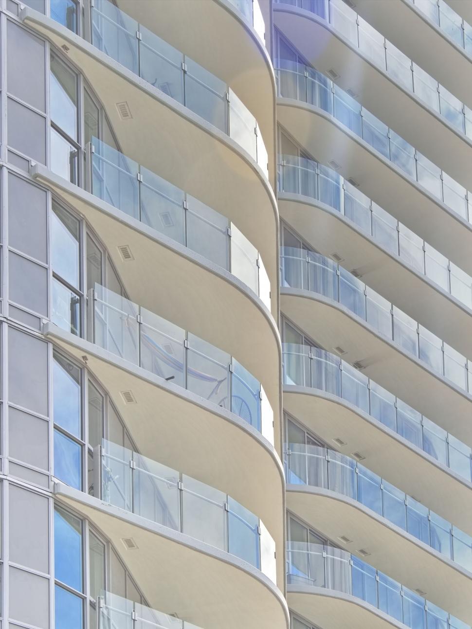 Free Image of Curved balconies on a modern high-rise 