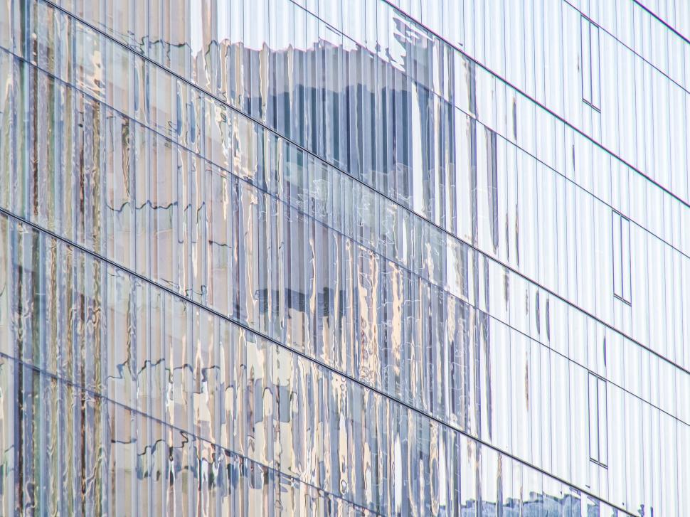 Free Image of Distorted reflections on a skyscraper s glass surface. 