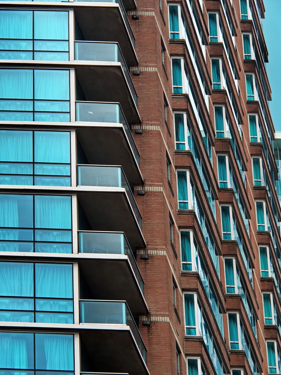 Free Image of Modern building with brick and glass facade, urban living 