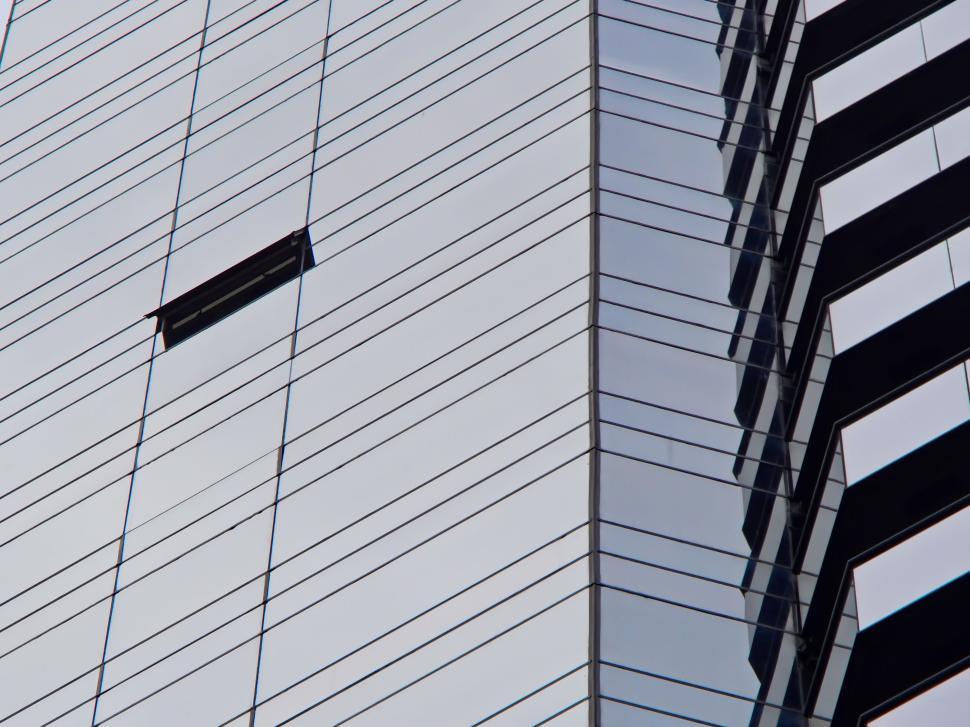 Free Image of Modern glass building with open window, urban architecture 