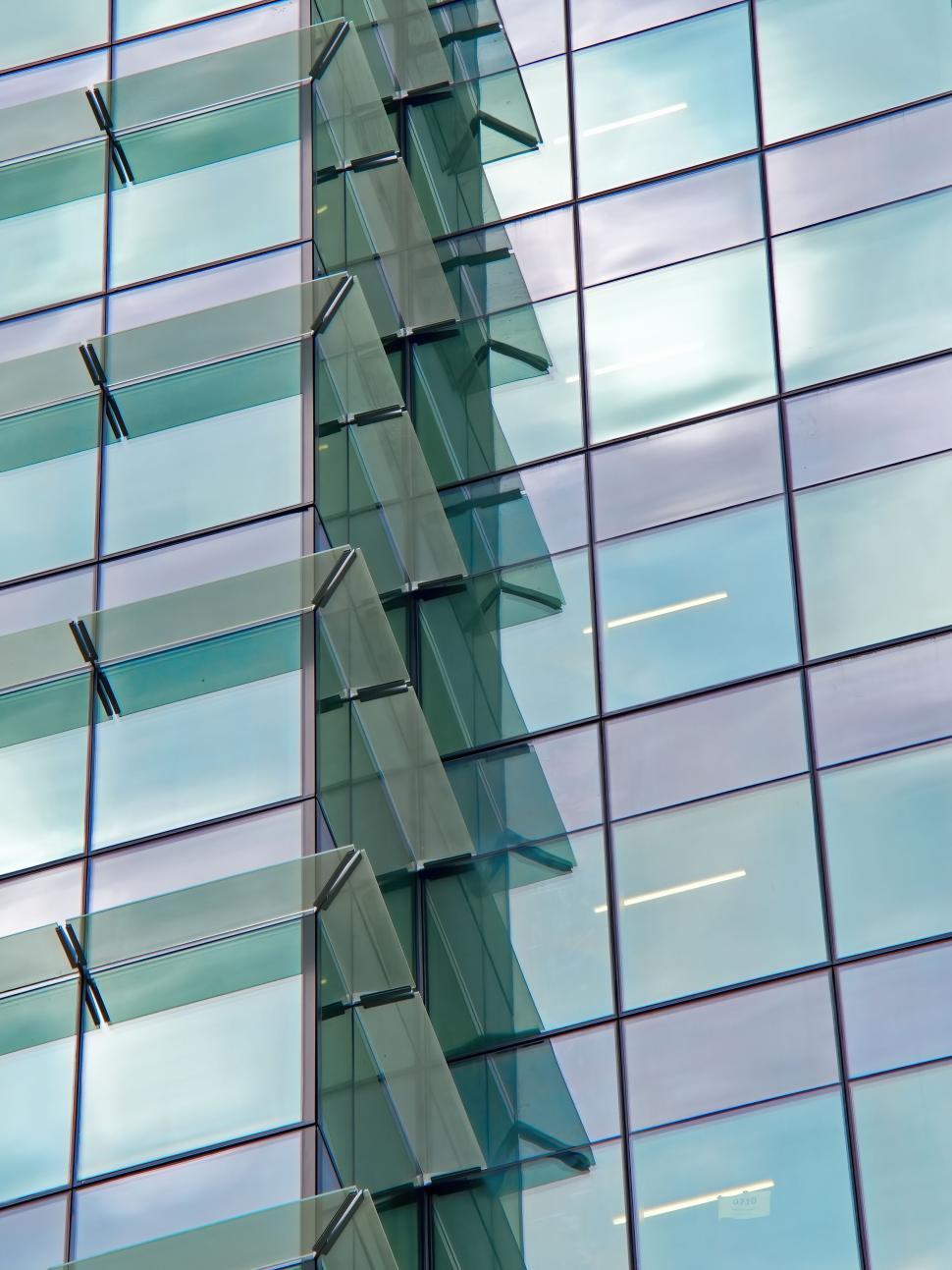 Free Image of Reflections of glass exterior of a modern business building. 
