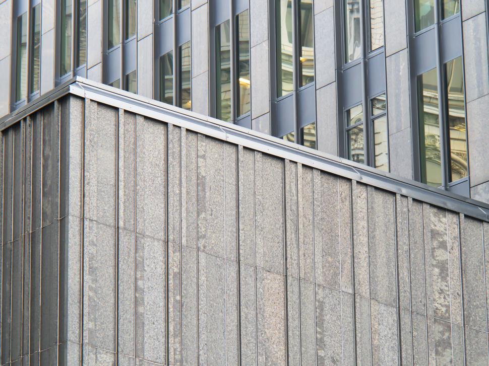 Free Image of Modern building facade with large windows and textures 