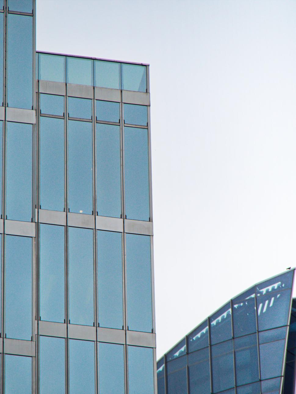 Free Image of Tall modern building with clear reflective windows 