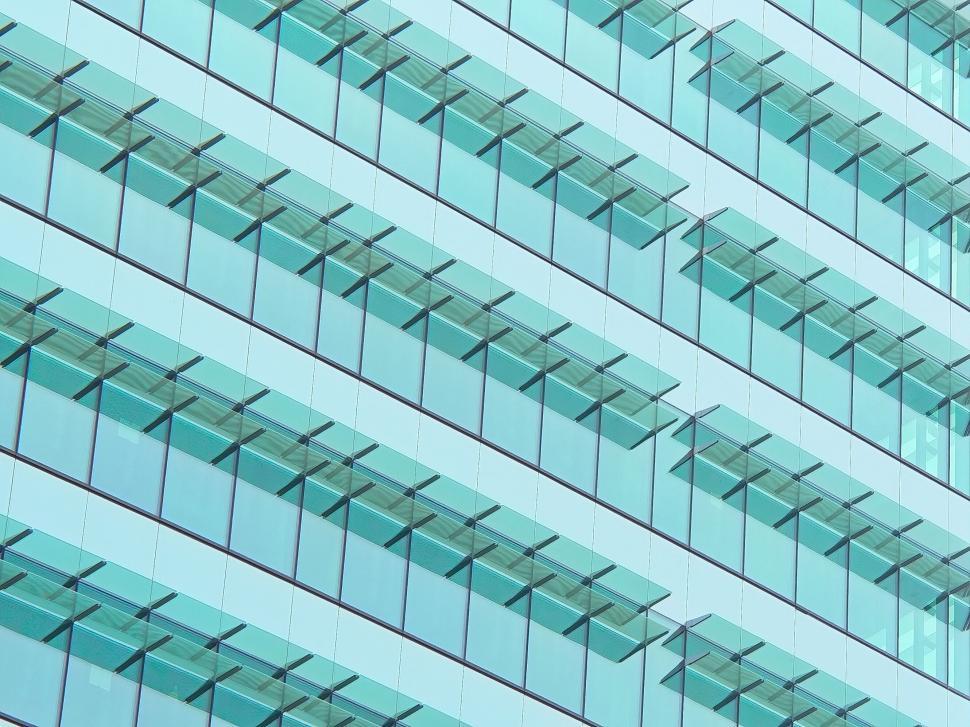 Free Image of Office building facade with repetitive glass windows. 