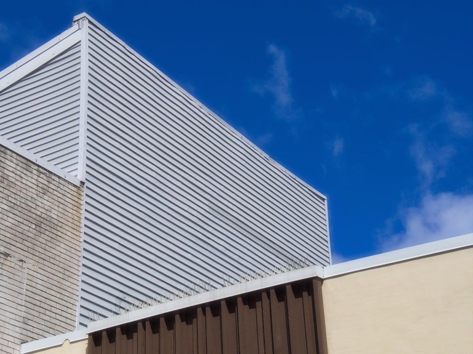 Free Image of Modern building exterior with various geometric shapes 