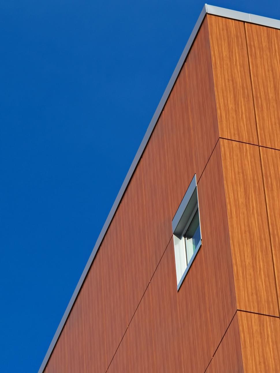 Free Image of Minimalist modern building with wooden facade and window. 