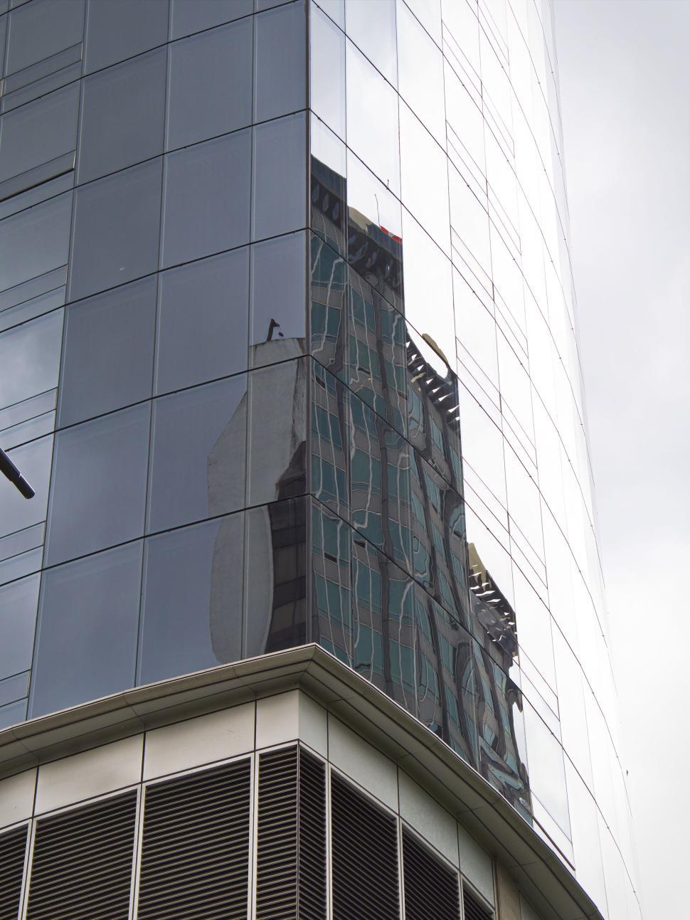 Free Image of Colorful modern building with rectangular glass windows. 