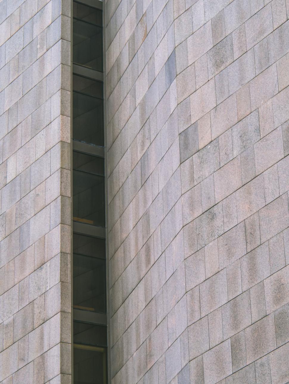 Free Image of Stone wall of contemporary building with linear patterns 