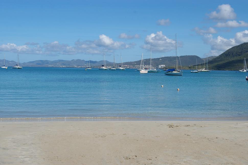Free Image of Boats Anchored at Sandy Beach 