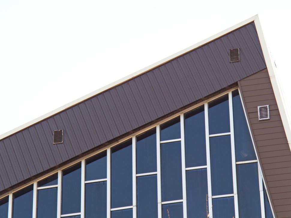 Free Image of A-Frame modern building with a slanted roof and vents 