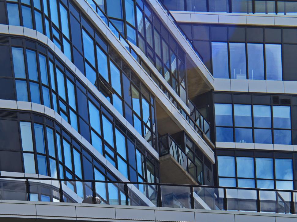 Free Image of Complex design of modern glass walled building. 