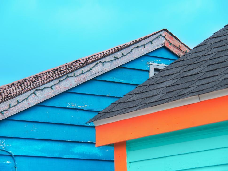 Free Image of Colorful wooden houses with contrasting paint colors 
