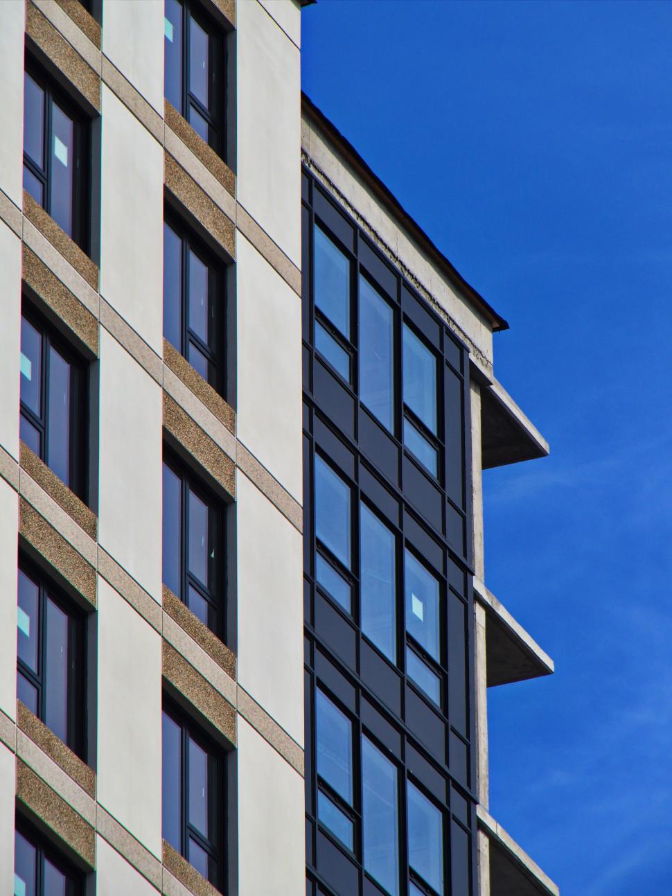 Free Image of Modern building with vertical windows and blue sky 