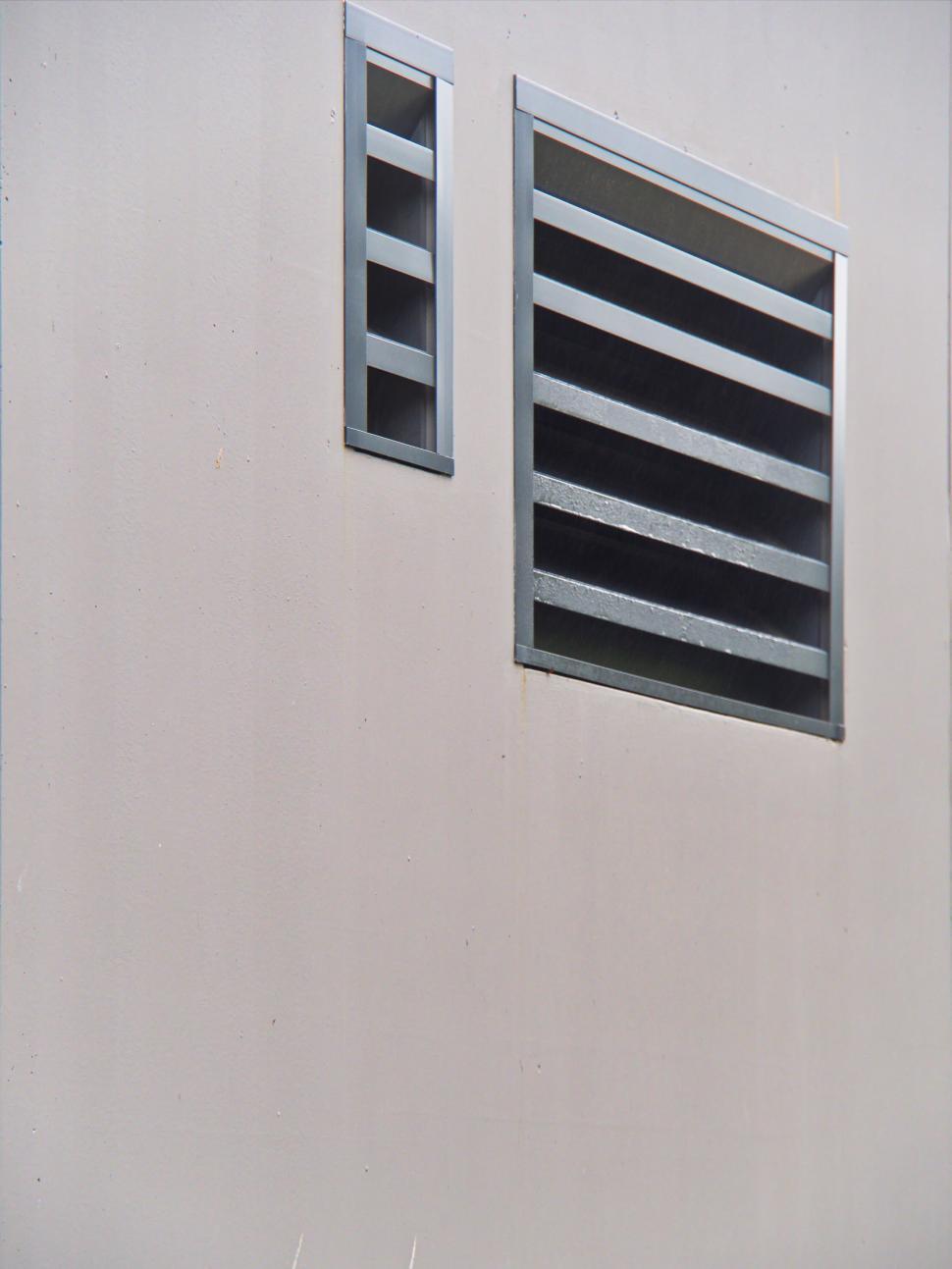 Free Image of Plain wall with small horizontal and large vents 