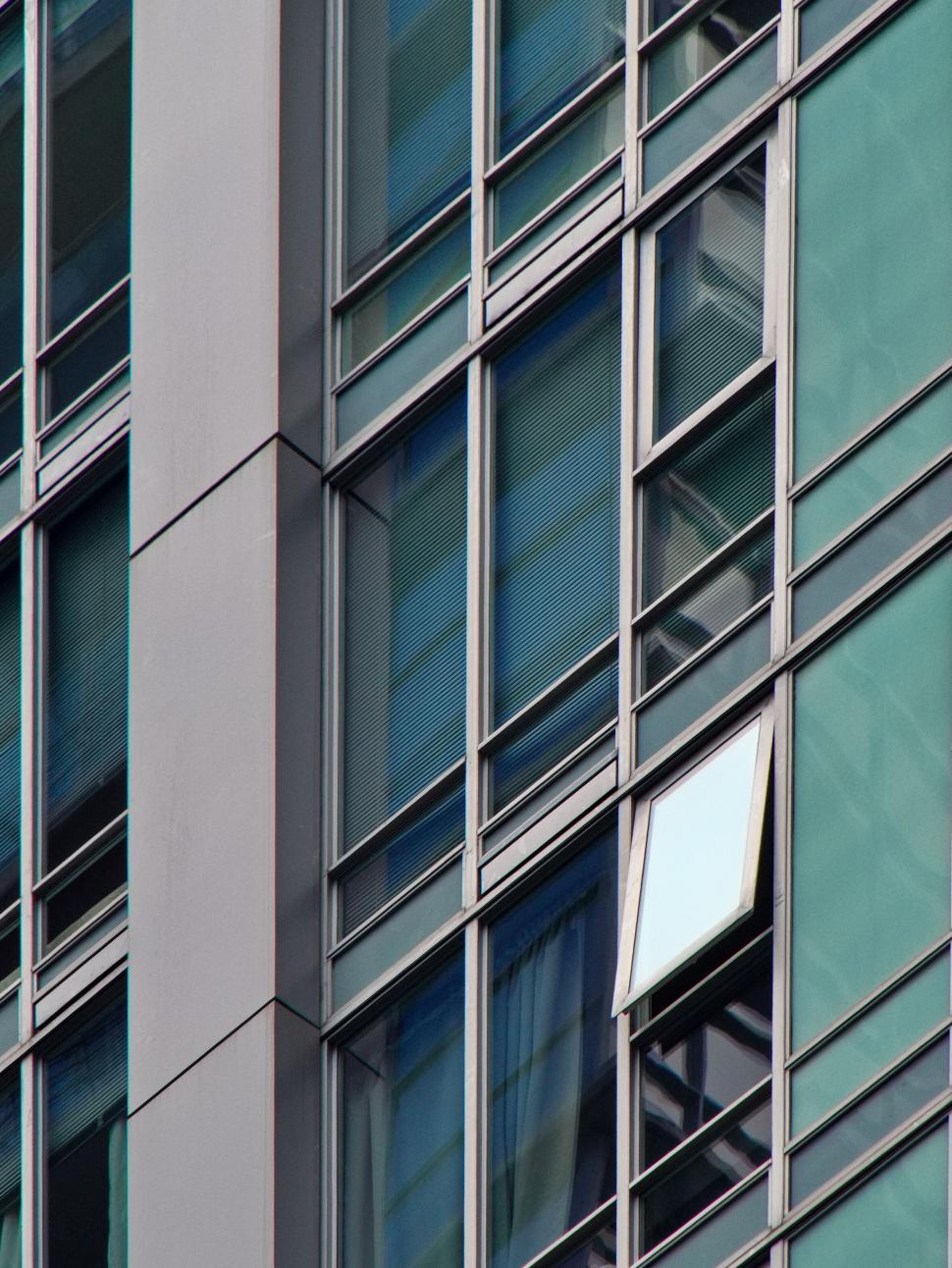 Free Image of Detailed view of glass windows on high-rise building 