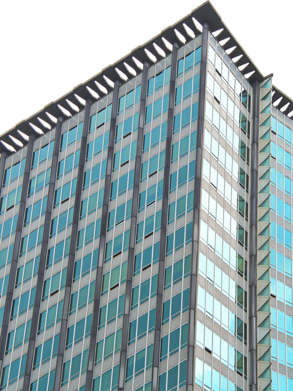 Free Image of High-rise office building with blue glass windows exterior 