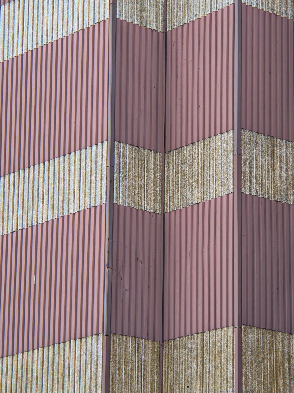Free Image of Striped industrial building with textured metal siding. 