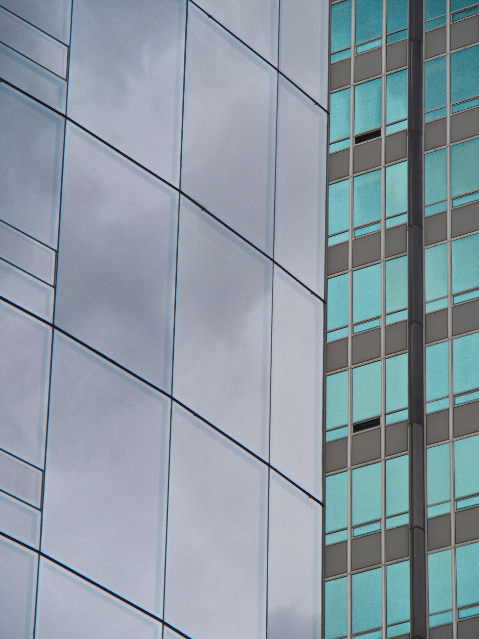 Free Image of High-rise building with mirroring glass windows surface. 