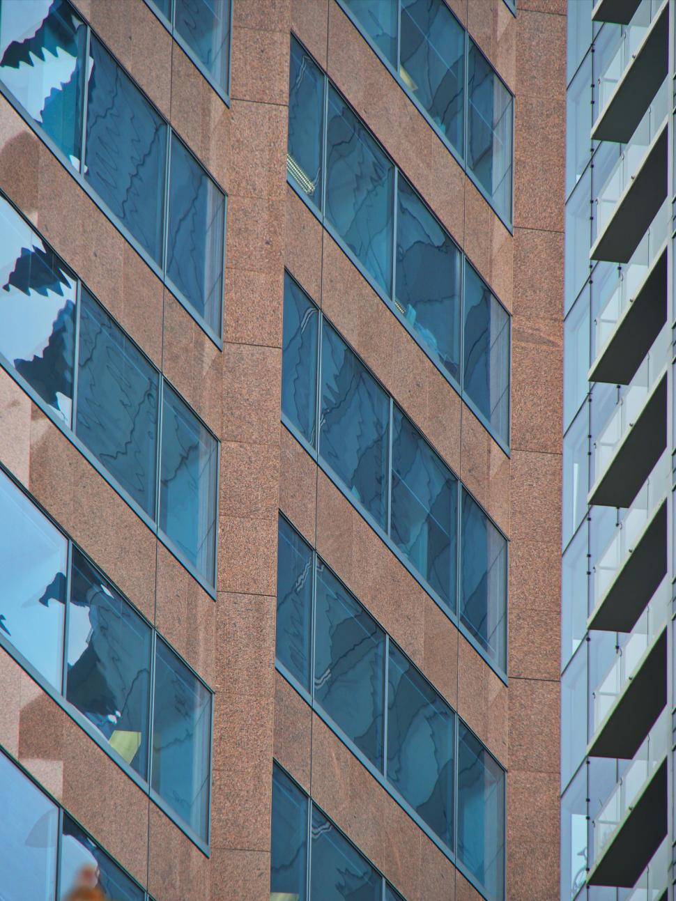 Free Image of Brown Brick Building with Diagonal Windows 