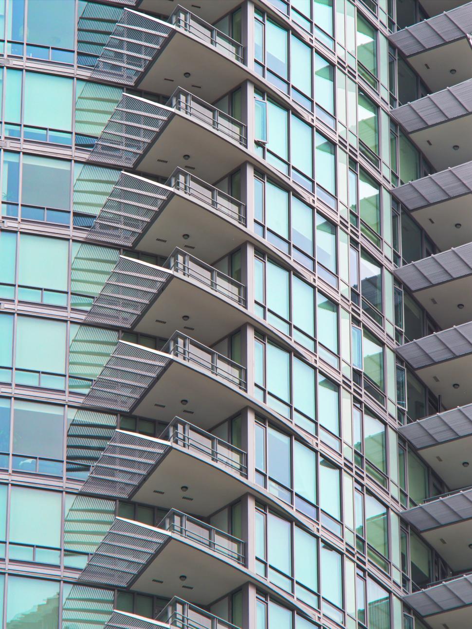 Free Image of Curved glass building with balconies in modern city 