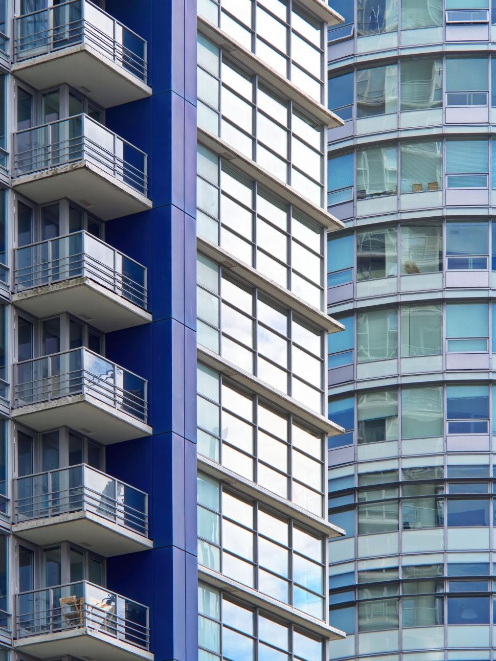 Free Image of Blue and glass buildings with balconies urban views 