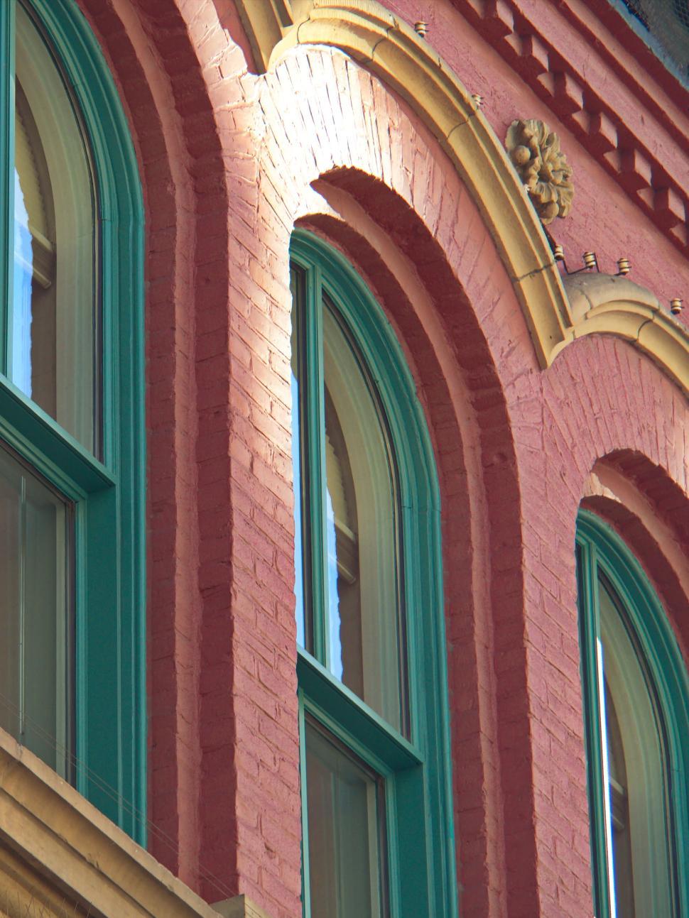 Free Image of Detailed architecture of a building with arched windows 