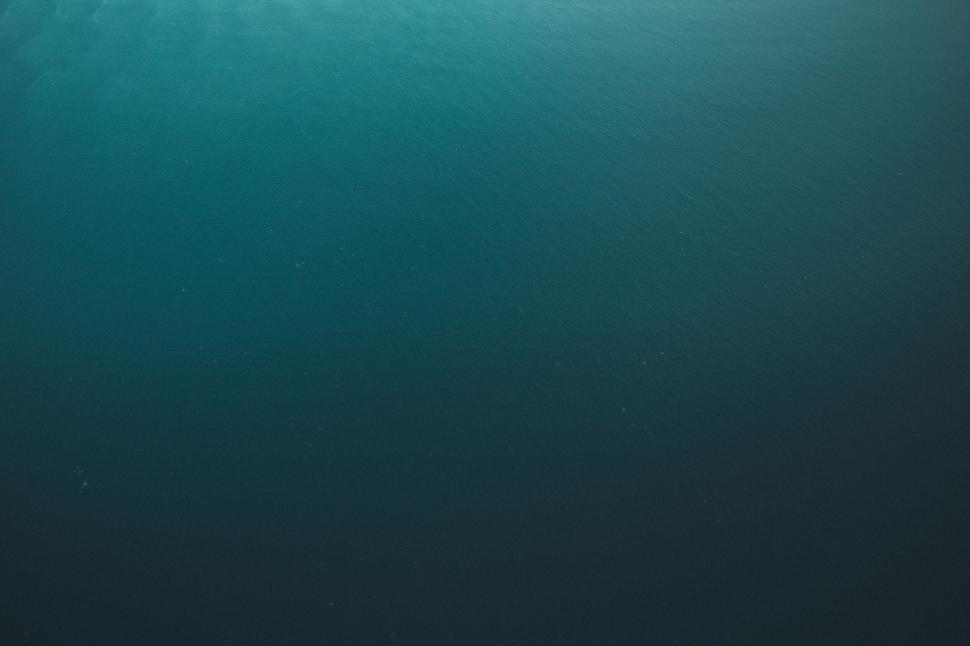 Free Image of Vast expanse of deep blue water with subtle rippling. 
