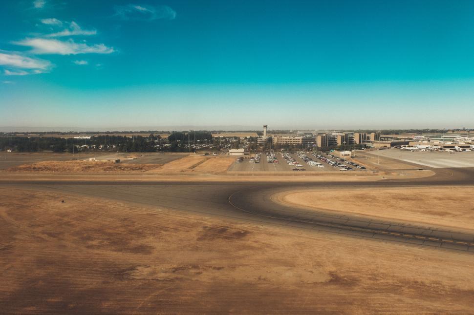 Free Image of Aerial view of airport runway with parked airplanes. 