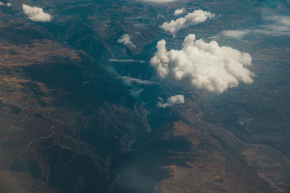 Free Image of High altitude landscape view with clouds and mountains. 