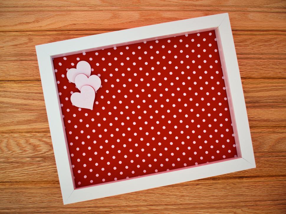 Free Image of White frame with red polka dot background and hearts 