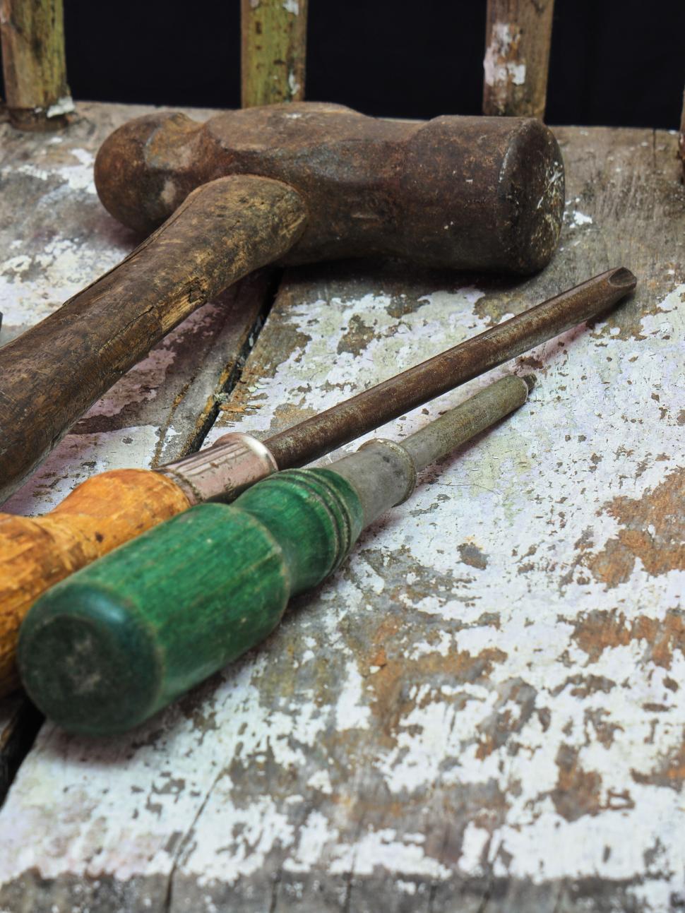 Free Image of Vintage tools hammer, chisel, screwdriver on rustic wood. 