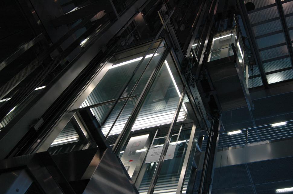 Free Image of Modern glass elevator with sleek interior lighting 