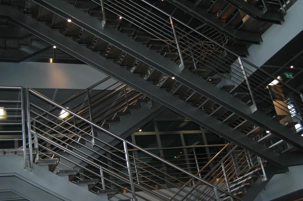 Free Image of Intricately designed metal staircases inside a building 