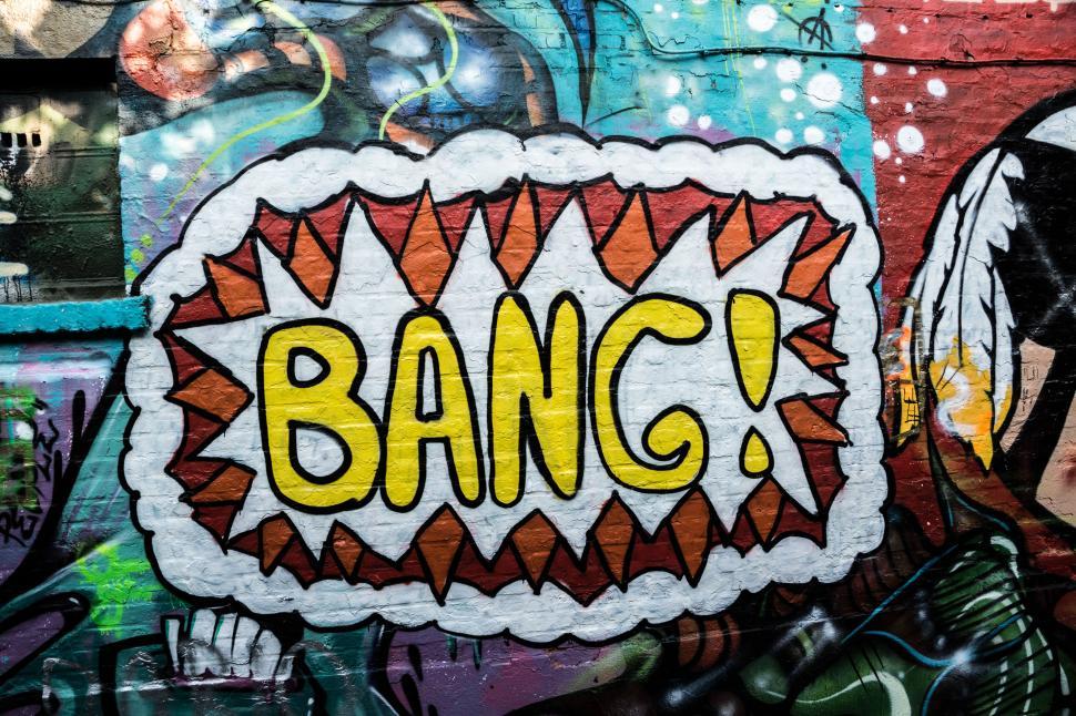 Free Image of Bang graffiti art on a brick wall with comic style pop 