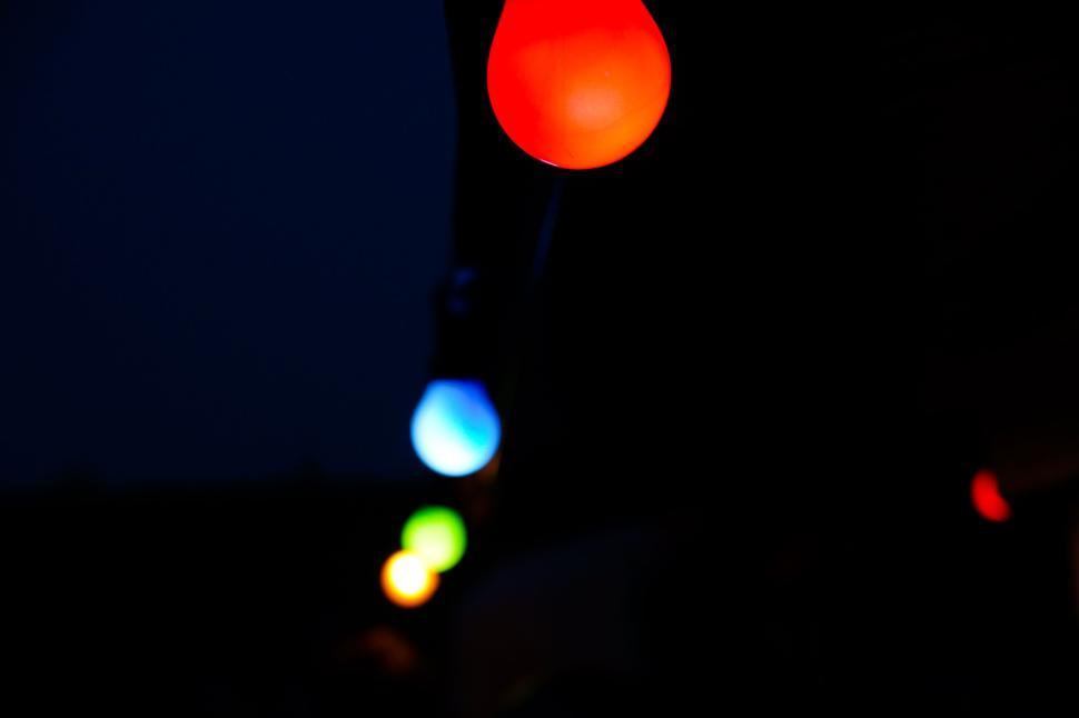 Free Image of Colorful Lights Against a Dark Background at Night 