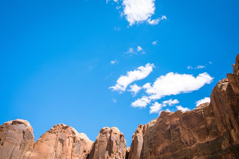 Free Image of Rock formations against a vibrant blue sky at midday 