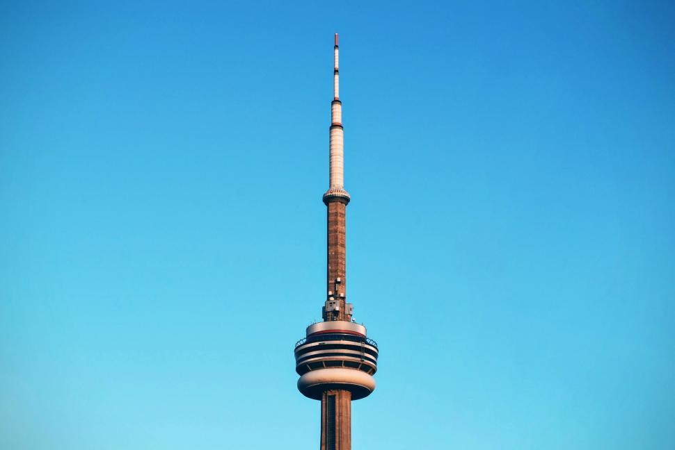 Free Image of Iconic CN Tower against a clear blue sky in daylight 