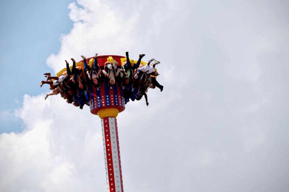 Free Image of Thrill-seekers on an amusement ride high in the sky. 