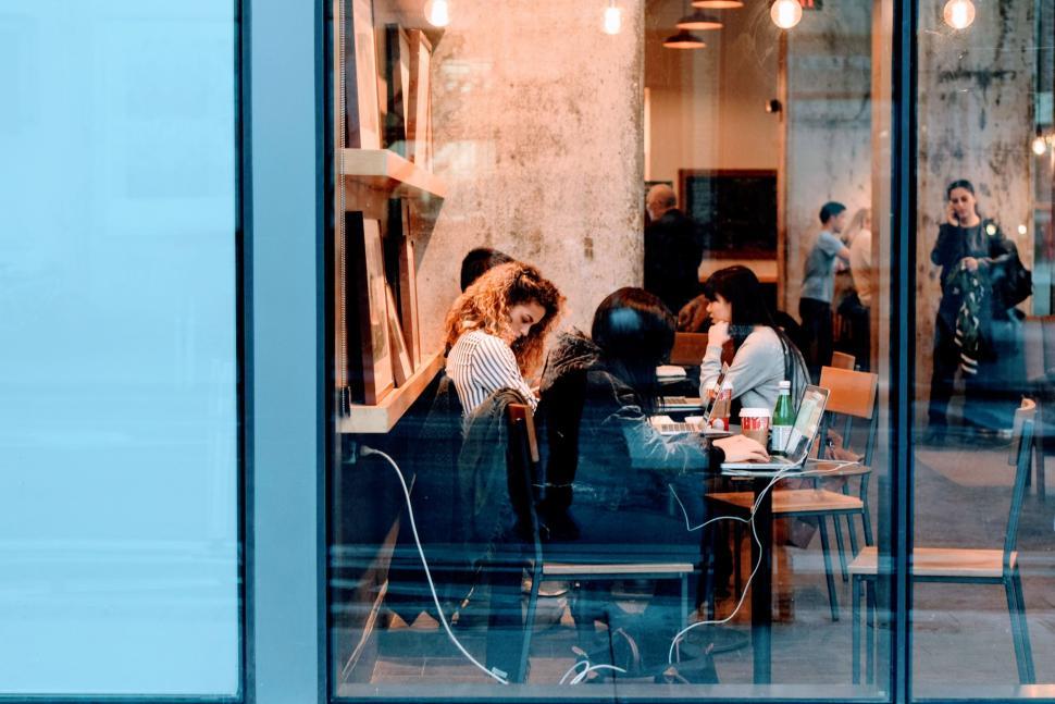 Free Image of Group of friends studying together in a modern cafe 