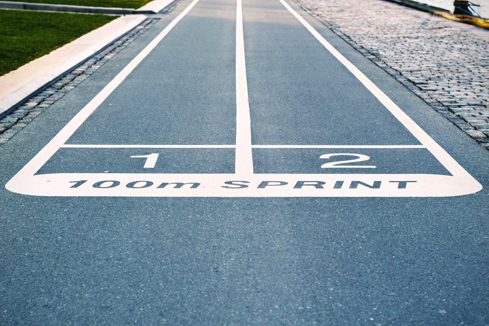 Free Image of 100m sprint track lanes 1 and 2 painted on asphalt 