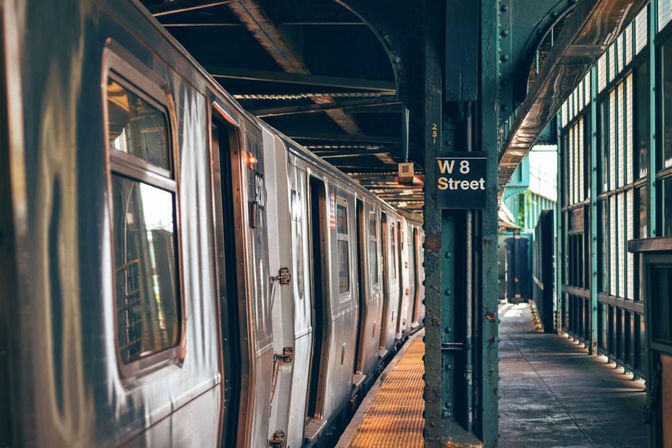 Free Image of Train at the W 8 Street station platform in New York City. 